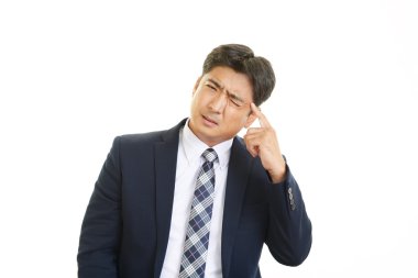 baş ağrısı olan işadamı