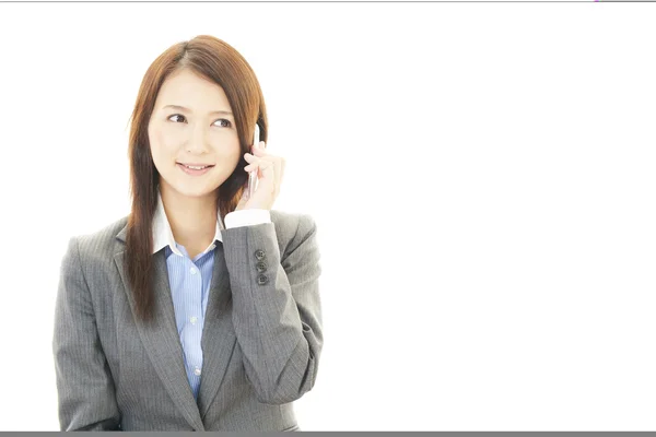Mulher de negócios com um telefone inteligente — Fotografia de Stock