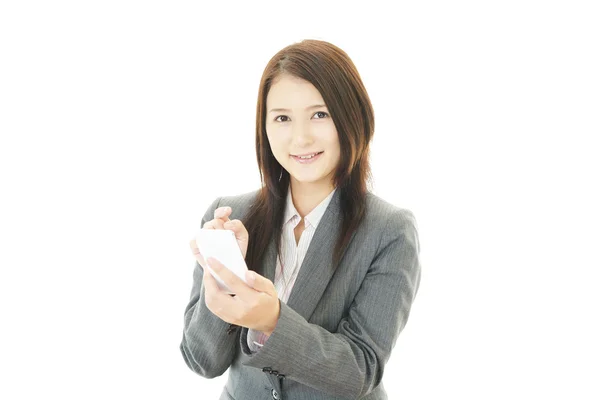 Business woman with a smart phone — Stock Photo, Image