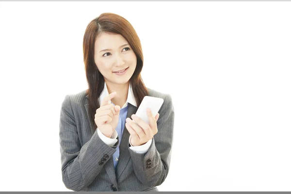 Business woman with a smart phone — Stock Photo, Image