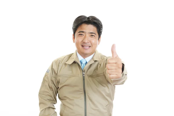 Asian worker with thumbs up — Stock Photo, Image