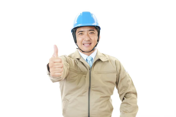 Trabalhador asiático com polegares para cima — Fotografia de Stock