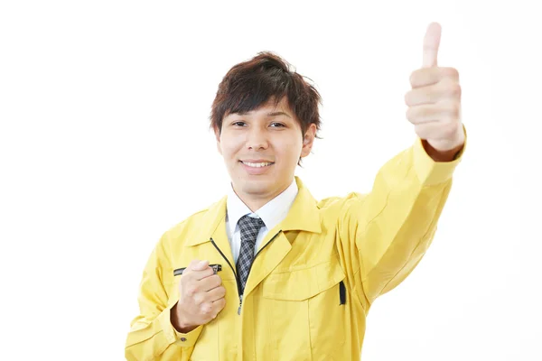 Trabalhador asiático com polegares para cima — Fotografia de Stock
