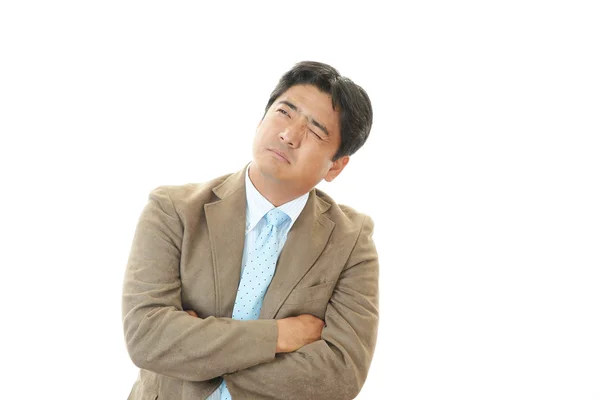 Стрессовый азиатский бизнесмен — стоковое фото