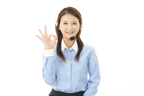 Call center operator making ok sign — Stock Photo, Image