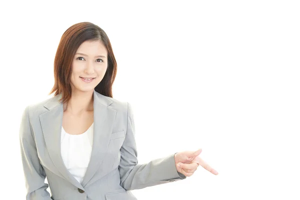 Young business woman pointing — Stock Photo, Image