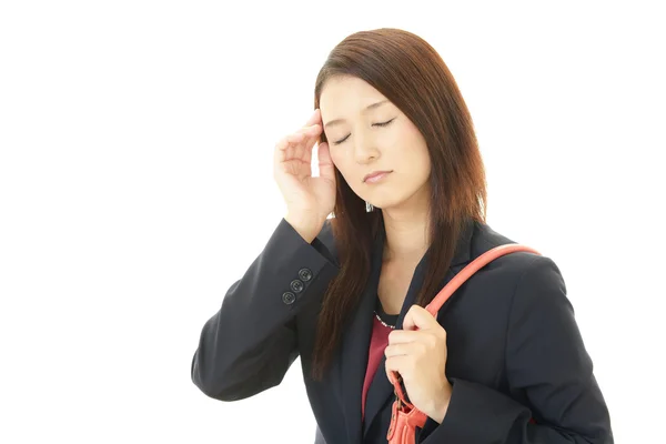 Business woman having a headache — Stock Photo, Image