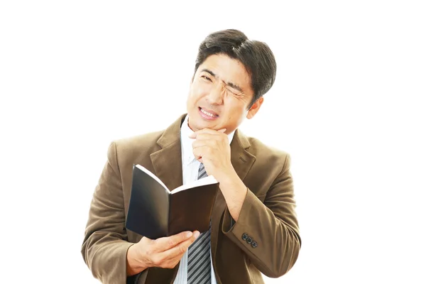 Tired and stressed Asian businessman — Stock Photo, Image