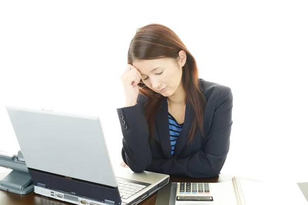 Tired young Asian business woman Stock Image