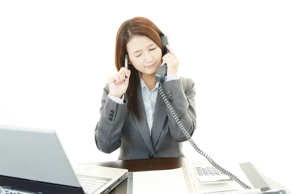 Tired and stressed young business woman Stock Photo