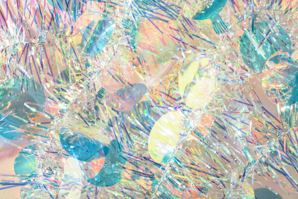 Красочные конфетти Рождественская мишура гирлянда текстура абстрактный фон.