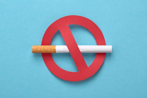 Red forbidden sign with a cigarette, No smoking concept. Stock Picture