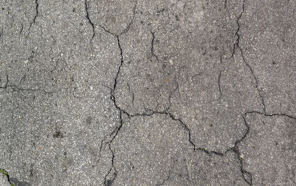 Textura da estrada velha com fendas — Fotografia de Stock