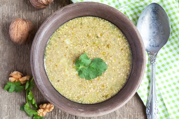 Traditional soup kharcho of beef broth with walnuts, cilantro an — Stock Image Traditional soup kharcho of beef broth with walnuts, cilantro an Stock Image