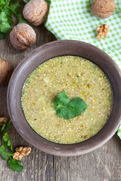 Traditional soup kharcho of beef broth with walnuts, cilantro an — Stock Image Traditional soup kharcho of beef broth with walnuts, cilantro an Stock Photo