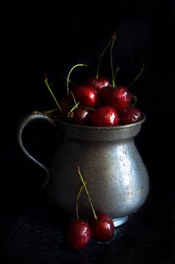 Cherries in a metal jug  clipart