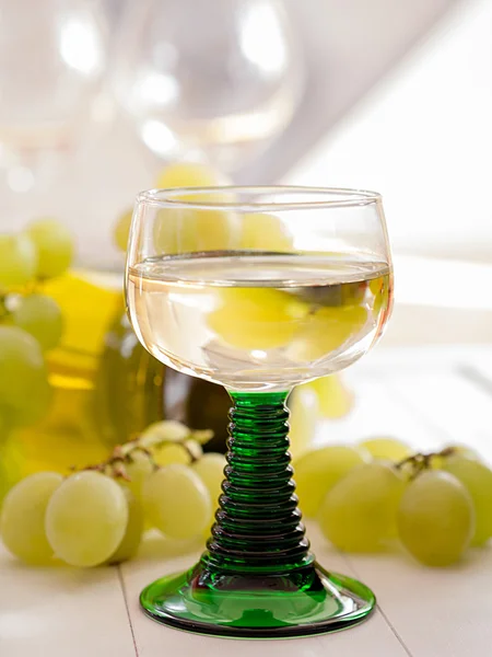 A glass of white wine in the roman glass — Stock Photo, Image