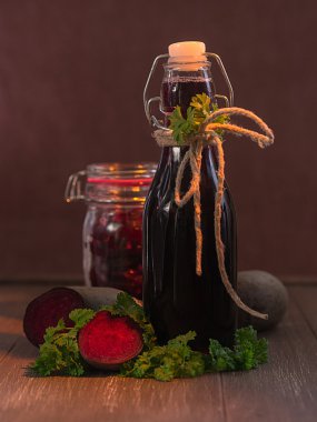 Beetroot in the glass and beetroot juice in a bottle clipart