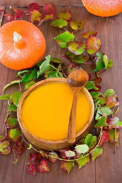 Pumpkin soup in a wooden bowl — Stock Photo, Image