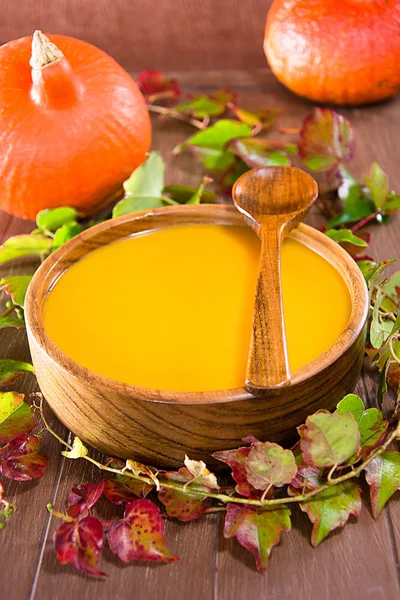 Pumpkin soup in a wooden bowl — Stock Photo, Image