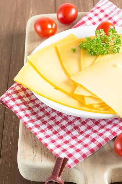 In discs of cut cheese — Stock Photo, Image
