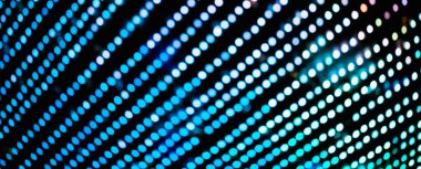 Doğal bokeh dokusuna sahip renkli bir arka plan ve sönmüş parlak ışık deseni. Teal ve turuncu arka planda yanıp sönen ışıklar. Kutlama çok renkli kaplama renk pankartı