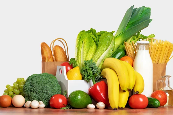 Delivery of grocery. Box with fresh fruit and vegetables bright green produce. Eco friendly responsible lifestyle and shopping. Healthy eating, zero waste concept. Copy space. Donation.