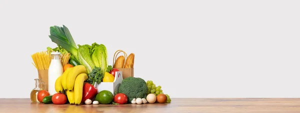 Delivery of grocery. Group of fresh fruit and vegetables bright green produce bread. Eco friendly responsible lifestyle and shopping. Healthy eating, zero waste concept. Copy space. Donation. Banner
