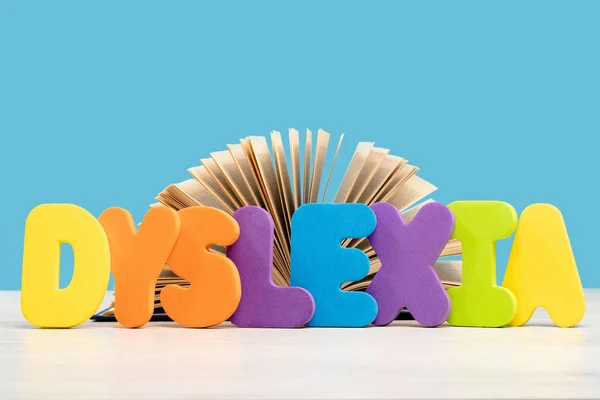 Dyslexia Word Multicolored Letters Wooden Desk Blue Background Reading Difficulty — Stock Photo, Image