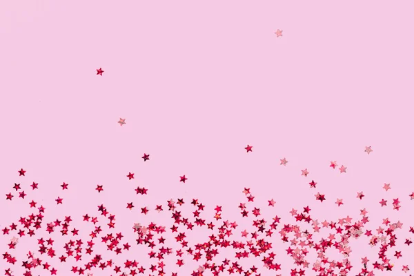 Festive Pink Holographic Glitter Confetti Star Shaped Candy Pink Background — ストック写真