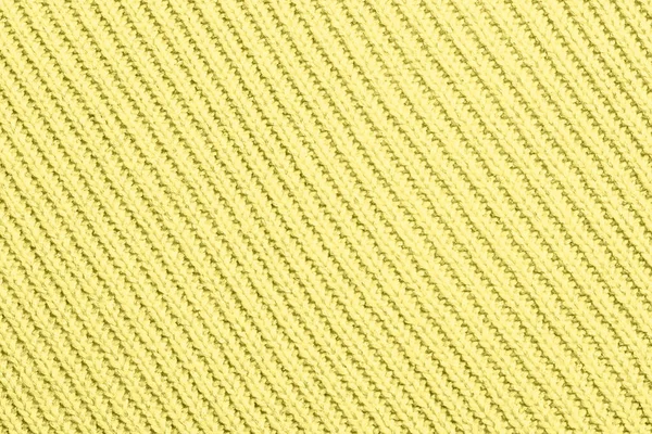 Textur av gult stickat tyg. — Stockfoto