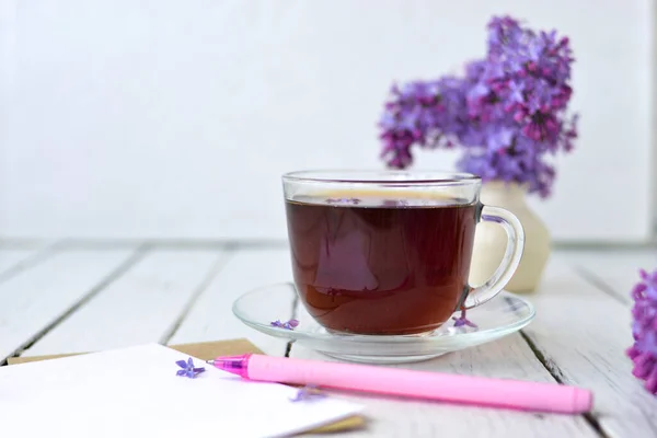 Delicate Morning Tea Table Setting Lilac Flowers Transparent Cup Tea — Stock Photo, Image