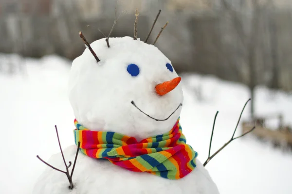 Fun snowman in scarf — Stock Photo, Image