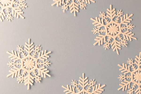 Snowflakes for New Year\'s decor on a blue background with space for text.