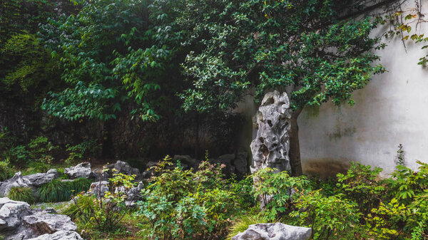 Giant rocks and trees at Lingering Garden Scenic Area in Suzhou, Jiangsu, China