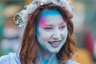 Young woman with painted face
