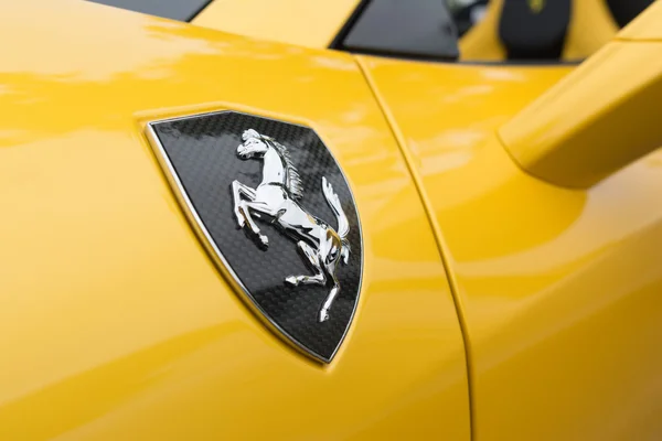 Yellow Ferrari horse logo — Stock Photo, Image