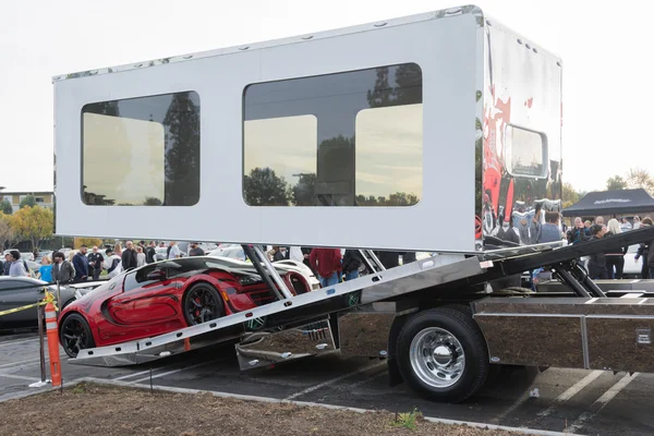 Bugatti Veyron entering enclosed auto transport Stock Picture