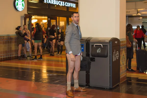 A man without pants in the Union Station during the  