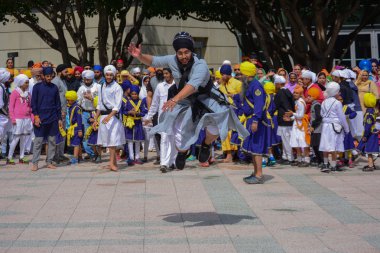 Devotee Sikh man dancing clipart