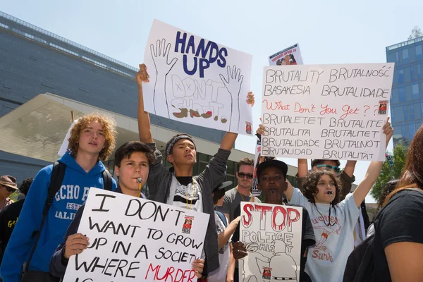 Group of people holding signs and blowing whistles — Stock Photo, Image