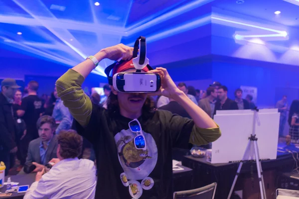 Man tries virtual reality Samsung Gear VR headset