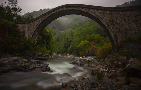 Artvin Arhavi double arches Bridges known as cifte kopruler with natural forest and blue sky background.