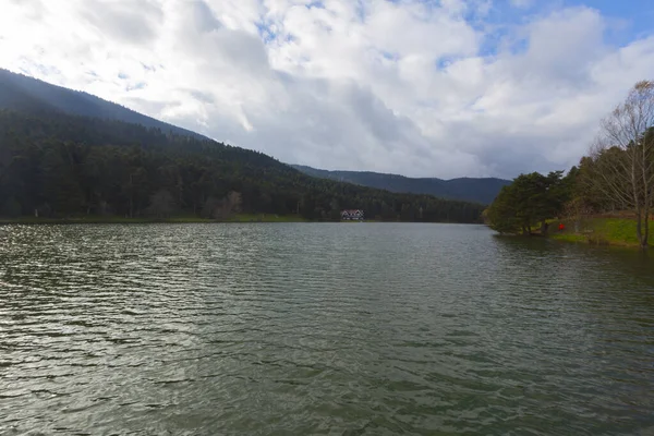 A mountainous nature park with a lake, forests, hiking trails and picnic areas.