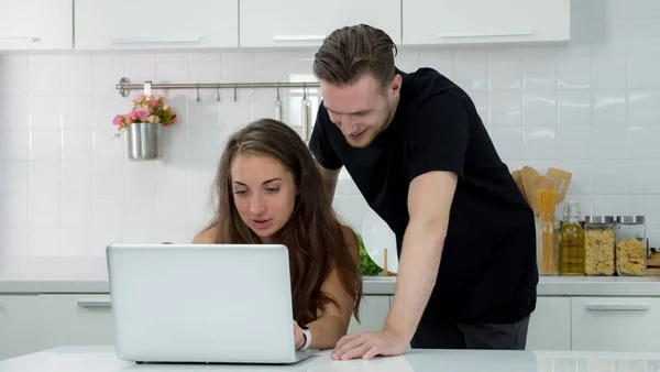 Portrait Couple Using Computer Find Out How Cook Kitchen Stock Picture