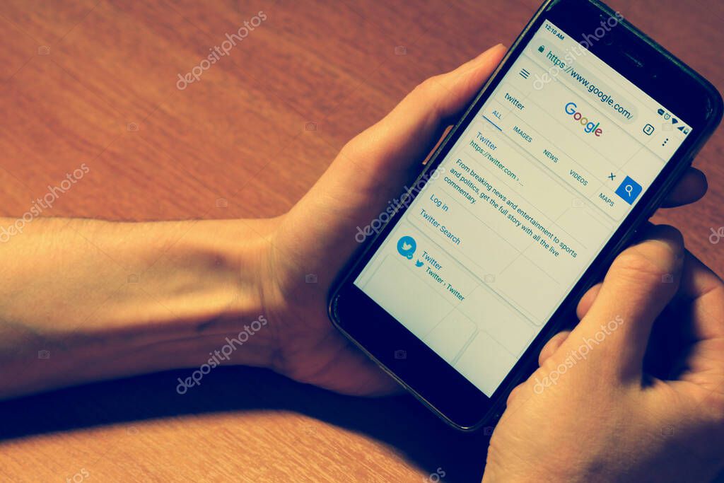 St. Petersburg, Russia, November 22 2018. Inscription twitter in google search bar. close up hand with smartphone. High quality photo