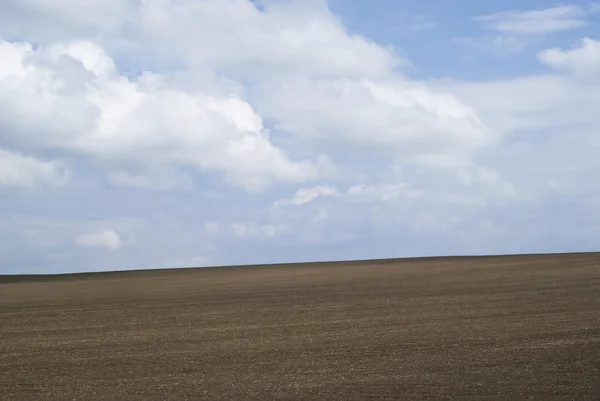 Plowed field on the hill — Stock Photo, Image