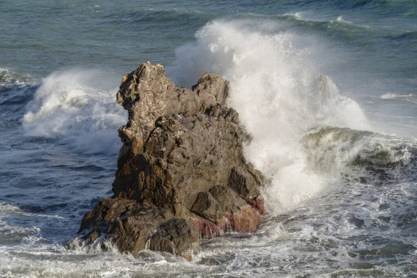 Stormy waves crashing on rocky beach called Galeazza, Province of Imperia, Liguria, northwestern Italy