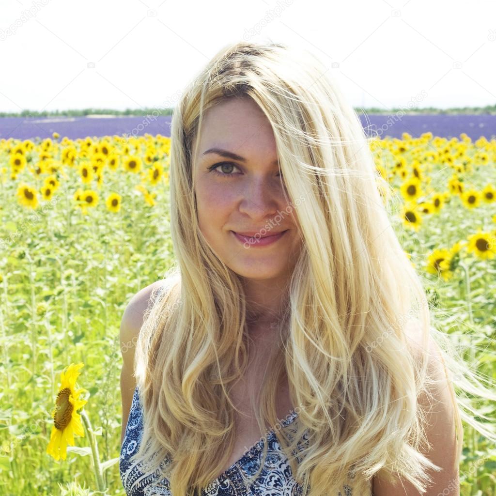 Woman in field sunflowers