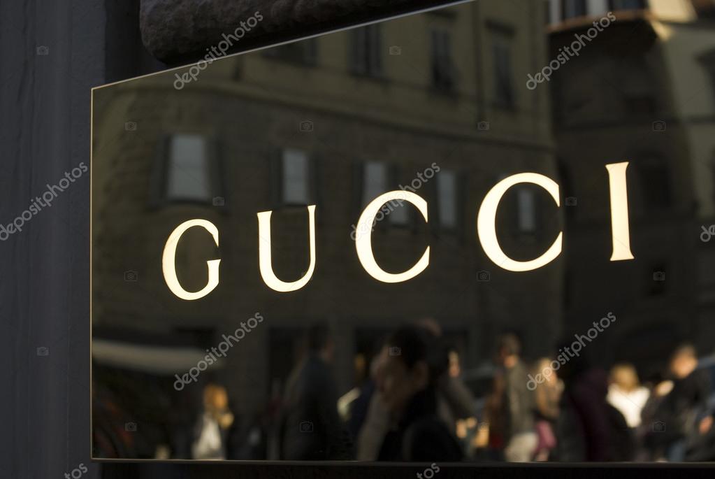Florence, Italy - October 31, 2015: Gucci store sign located in Via Tornabuoni, the Florence shopping street par excellence, with shops and boutiques of the most prestigious Italian and international fashion brands